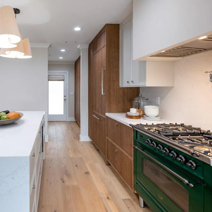 Kitchen with wide-plank light oak hardwood flooring