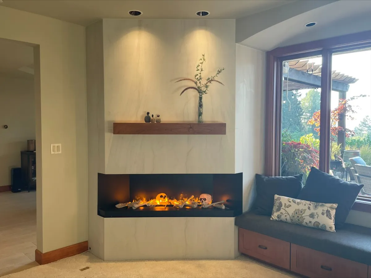 Fireplace wall finished in large honed white tile