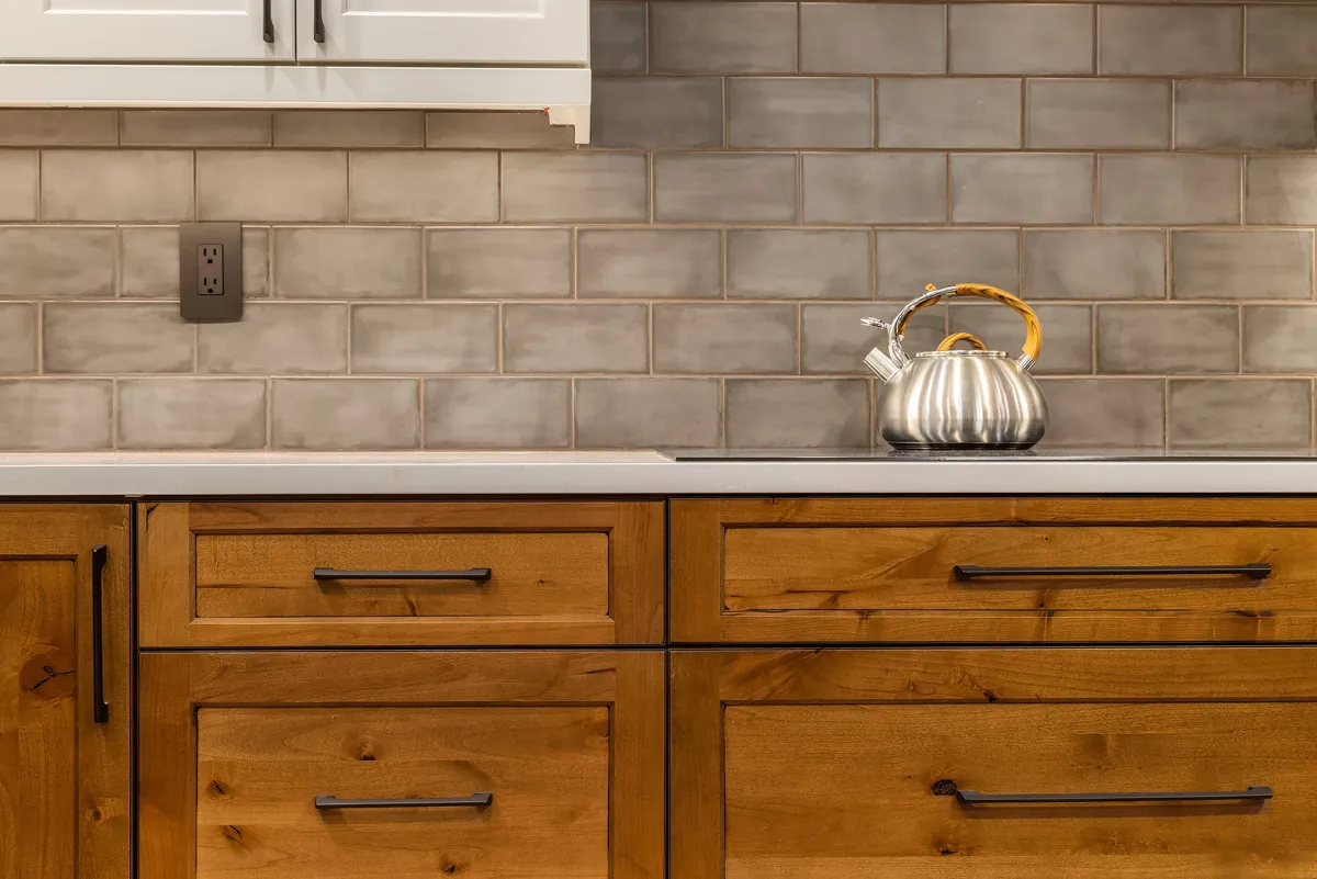 Kitchen with wood cabinets and tile backsplash